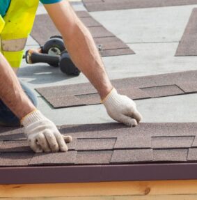 A person replacing a roof in Smithfield, VA and Southside, VA