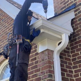488526822_1236122428516904_1460309069171384702_n A person replacing gutters in Smithfield, VA and Southside, VA
