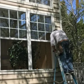 on+ladder+with+windows+open-640w.jpg window replacement Smithfield, VA Window installation Southside, VA